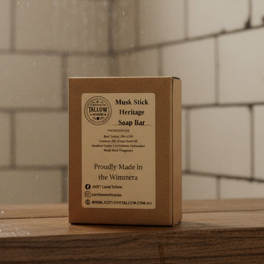 Musk Stick Heritage Soap Bar packaging with branding and product details on a gray background