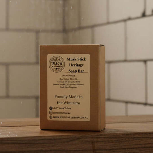 Musk Stick Heritage Soap Bar packaging with branding and product details on a gray background