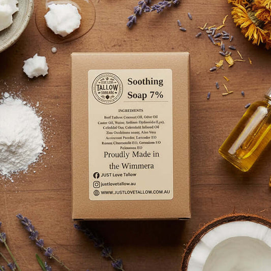 Brown cardboard box with 'Just Love Tallow' skincare product label on a light gray background