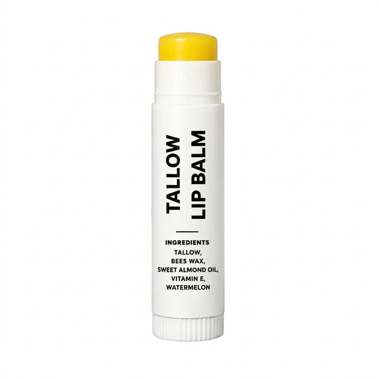 A white lip balm stick with a bright yellow cap, featuring black text that reads 'TALLOW LIP BALM' and listing ingredients including bees wax, almond oil, vitamin E, and cherry. The product is shown on a gray and white checkered background.