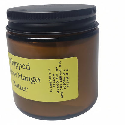 Jar of whipped tallow mango butter with a black lid on a white background