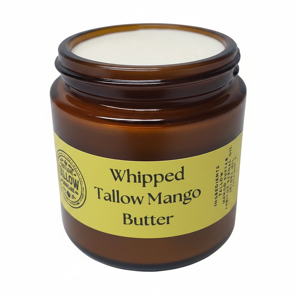 Jar of whipped tallow mango butter with a yellow label on a white background
