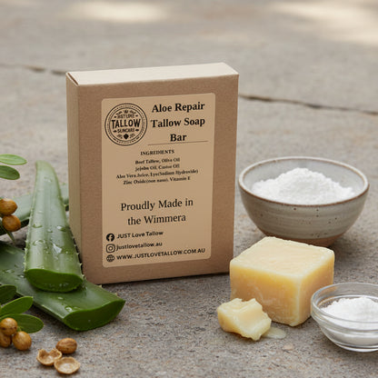 Box of Aloe Repair Tallow Soap Bar with branding and product details on a gray background