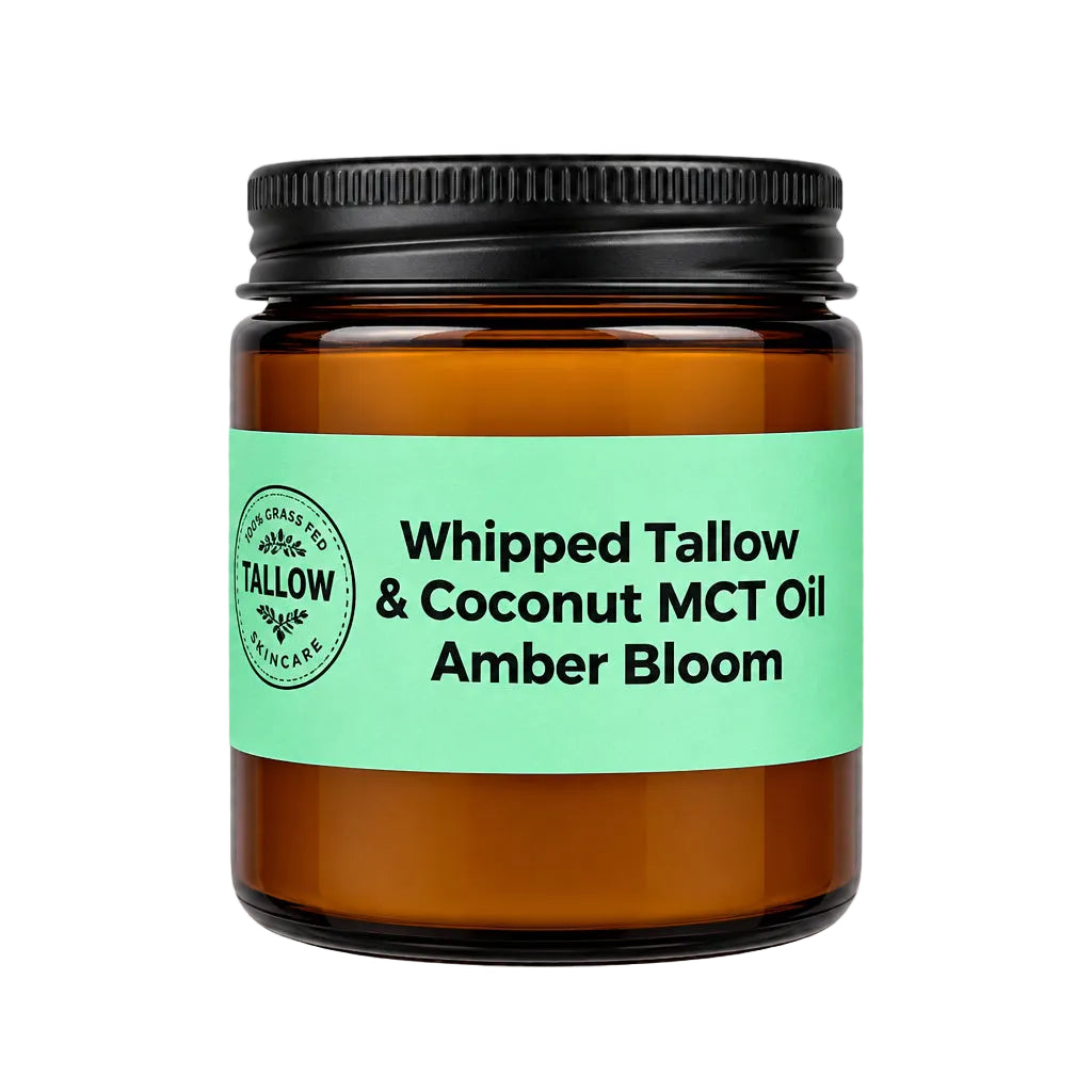 An amber glass jar of Tallow & Co. Whipped Tallow & Coconut MCT Oil in the Amber Bloom scent, featuring a mint green label and a black screw-on lid, shown on a white and gray checkered background.