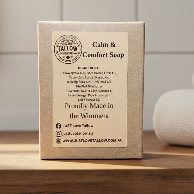 Box of Calm & Comfort Soap with ingredients list and branding details on a gray background