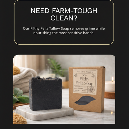 Black bar of soap and brown box labeled 'Filthy Fella Soap' on a marble surface with text about the soap's benefits.