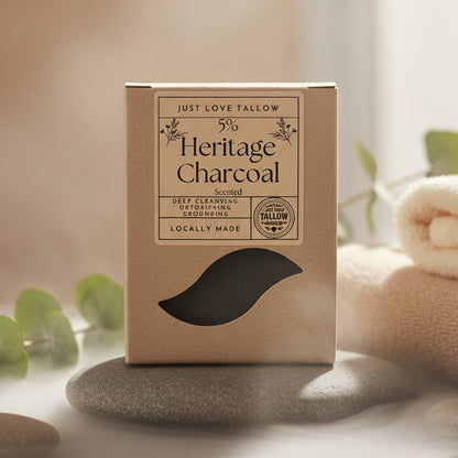 Box of Just Love Tallow Heritage Charcoal with a black charcoal product inside.