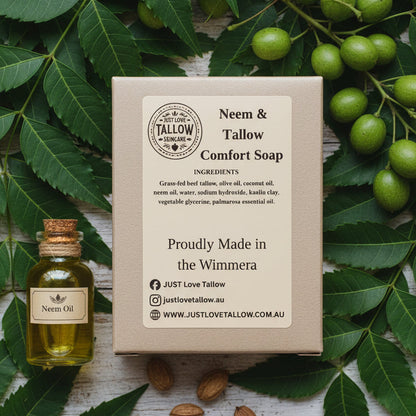 Box of Neem & Tallow Comfort Soap with branding and product details on a gray background